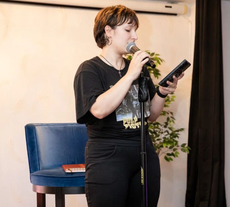 A performer at HIANA's open mic night